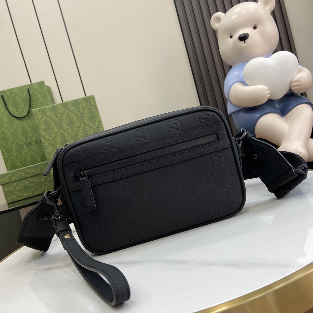 Gucci Crossbody Bags A range of men''s bags in black rubber effect leather Model: 771293. Dimensions: 17* 24* 5cm
