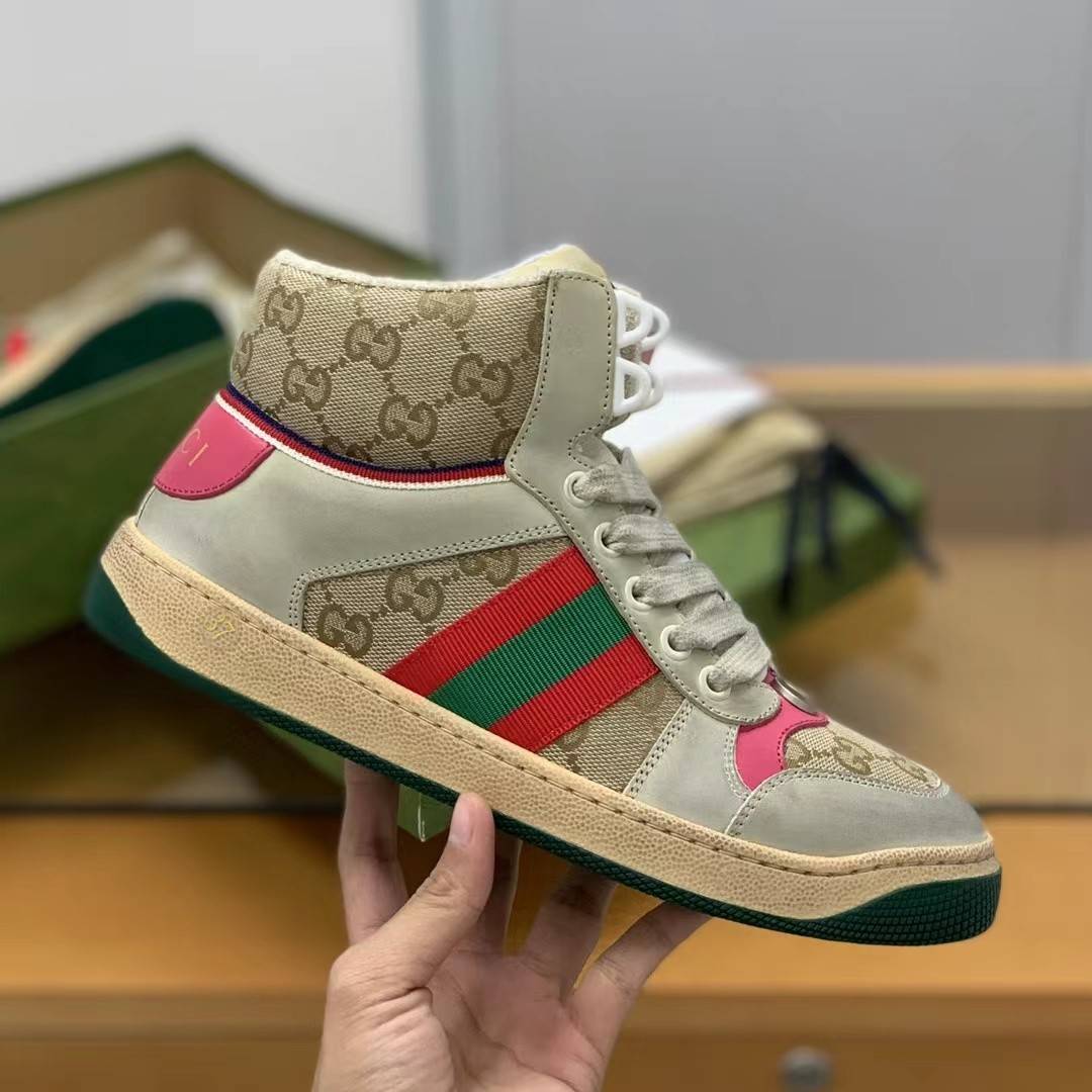GU*IHigh-top Distressed sneakers